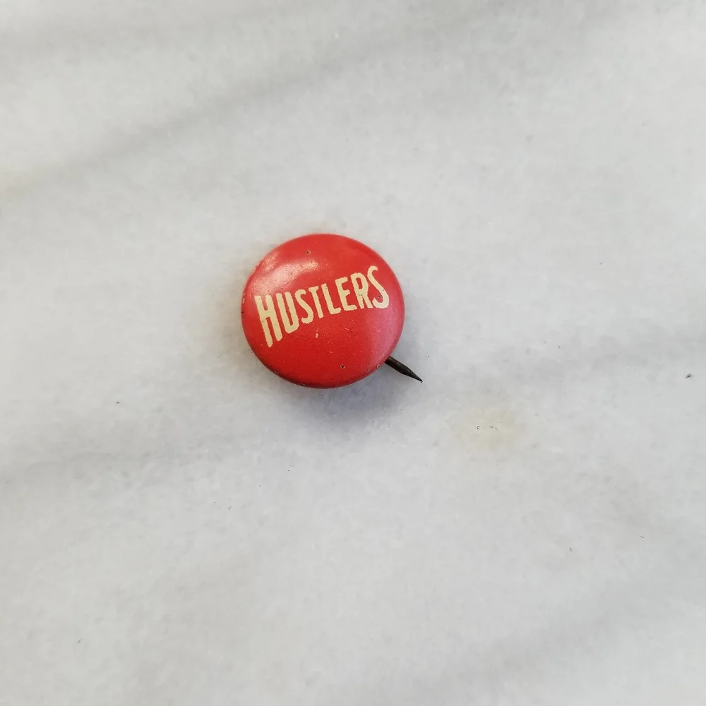 Vintage hustlers button